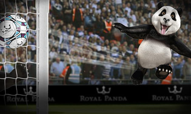 The cute Royal Panda mascot scoring kicking a football into a goal